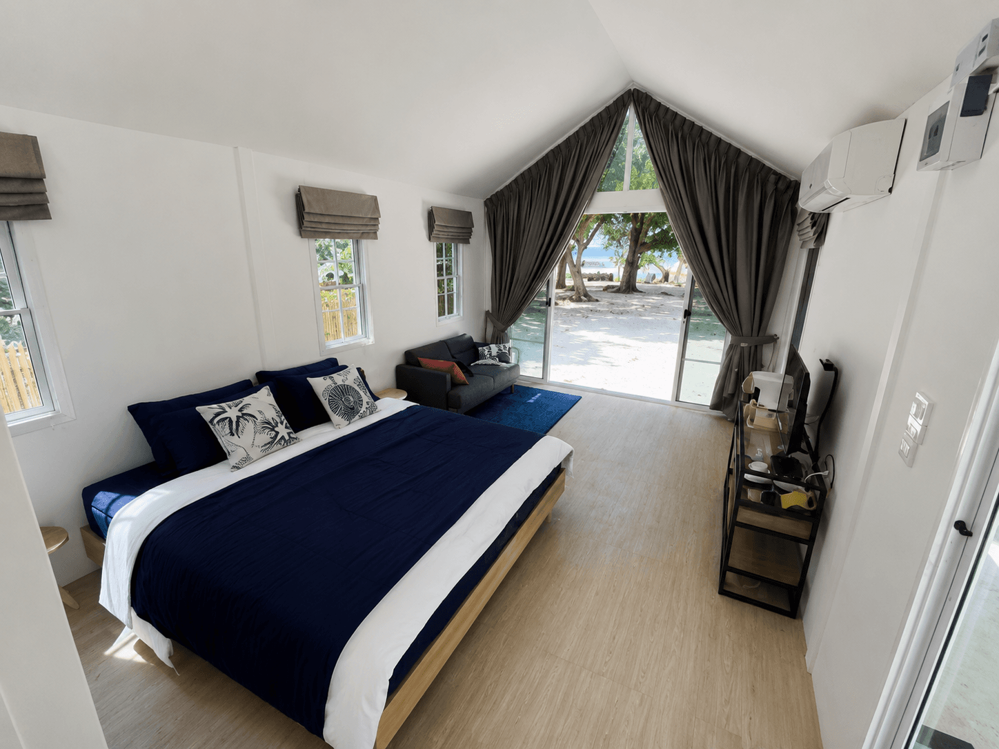 Villa bedroom with a view of the beach