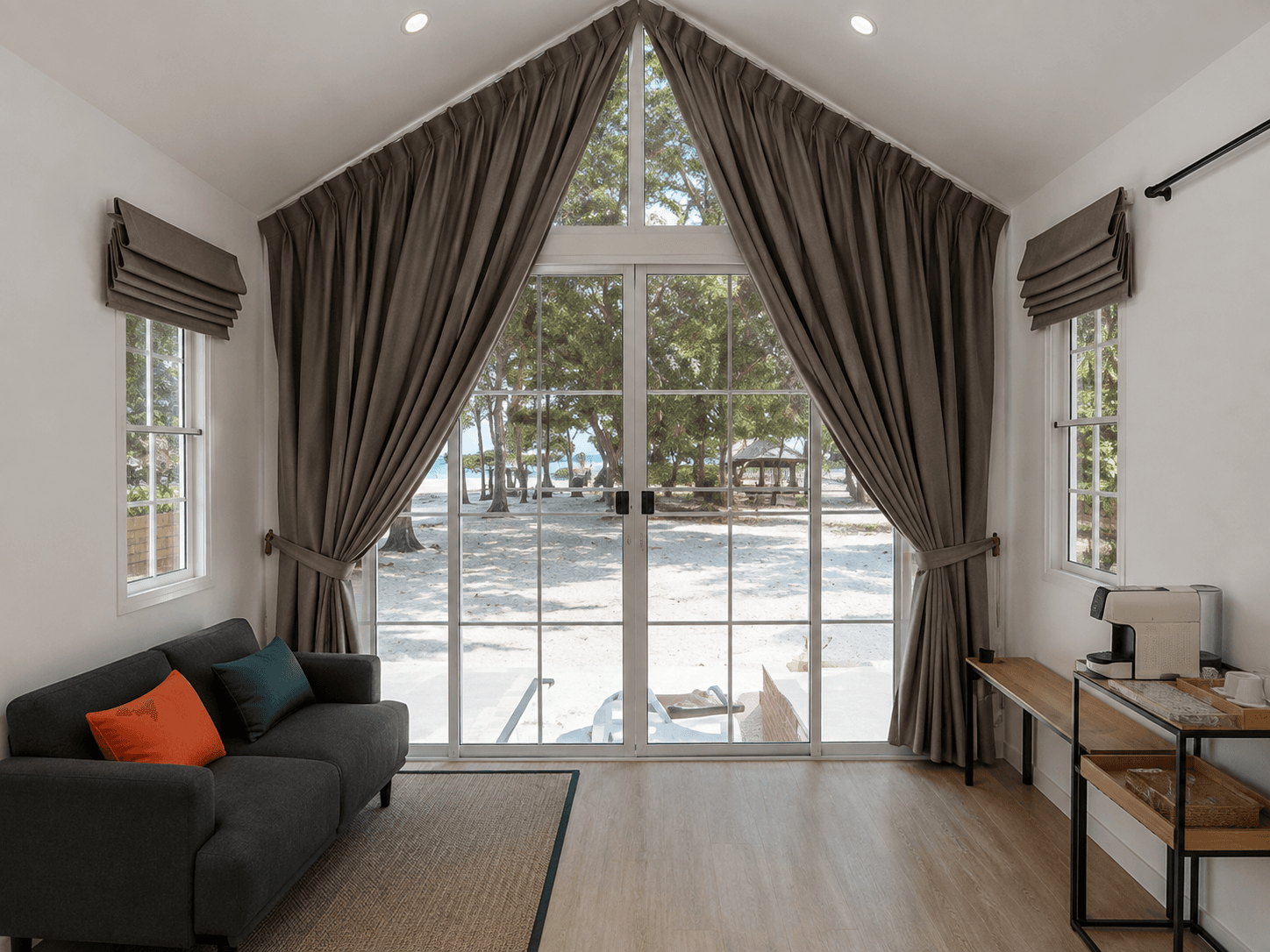Villa living room, A-frame window onto the sea