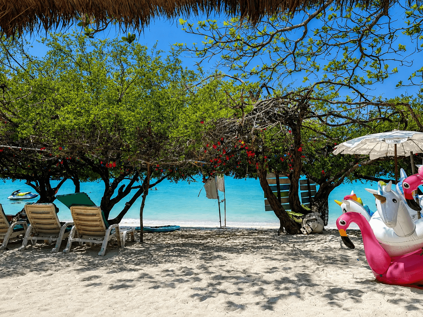 Beach loungers and inflatable floats on Tien Beach, Tiennara Resort