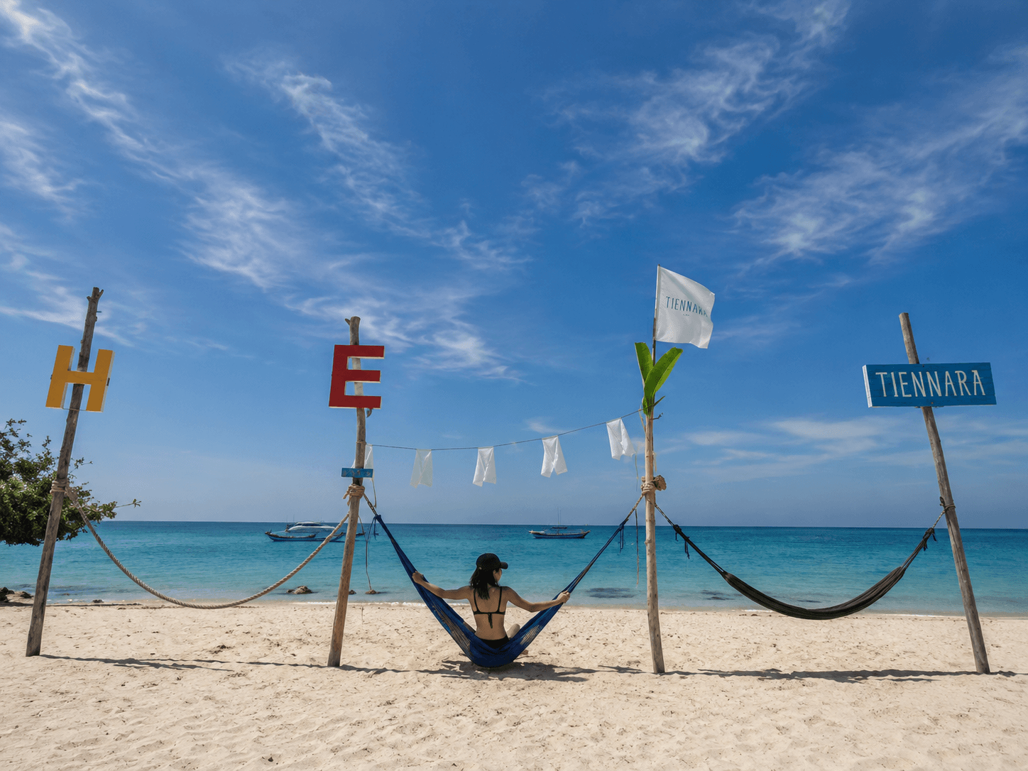 Hammock and signage on Tien Beach