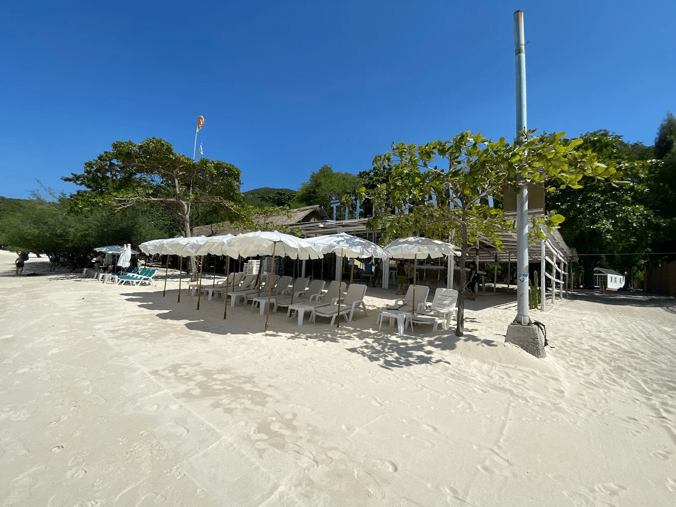 Sun loungers and umbrellas along Tien Beach